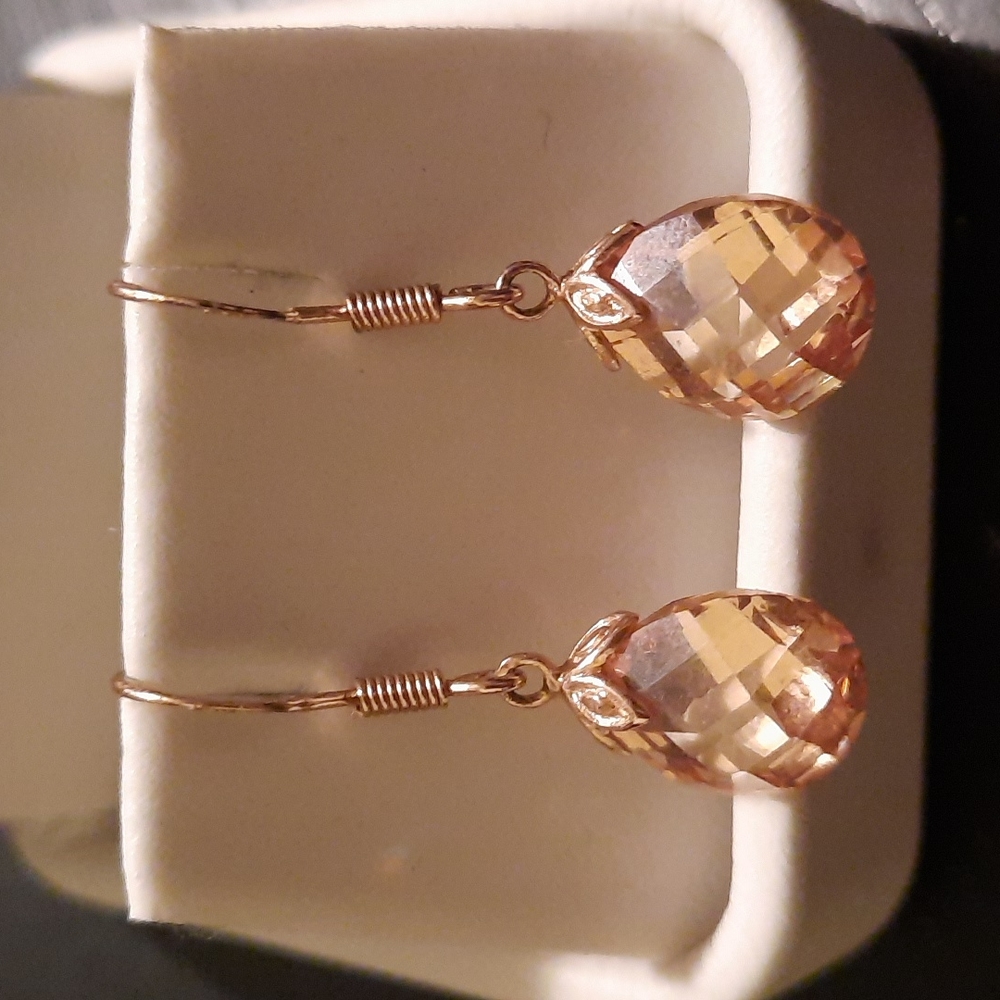 Rose gold tone earrings with pink crystal
